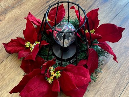 Christmas Wreath with poinsettia and metal black fairy light lamp For Sale